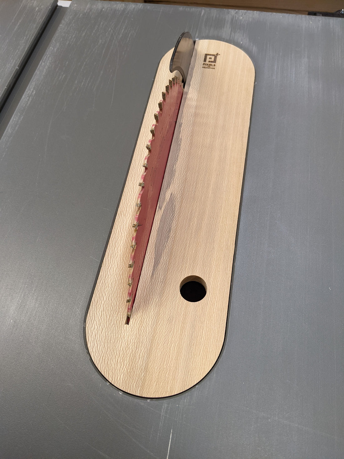Hardwood zero clearance insert installed in a DeWalt DWE7491 table saw