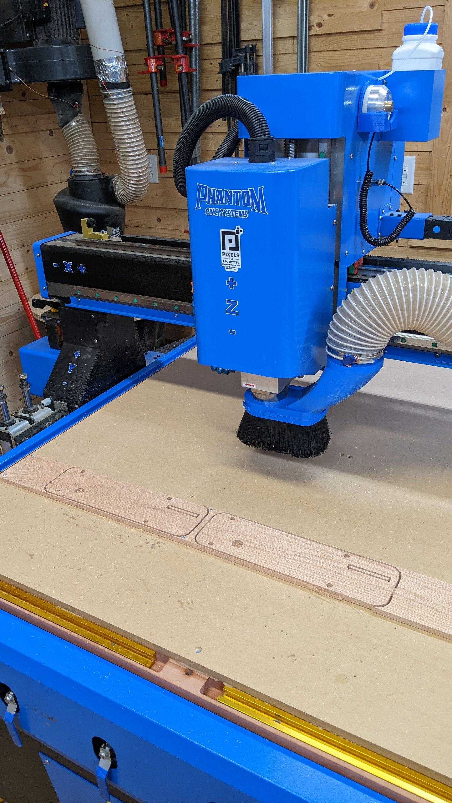Phantom CNC dust boot clamped on HQD spindle with 4 inch hose