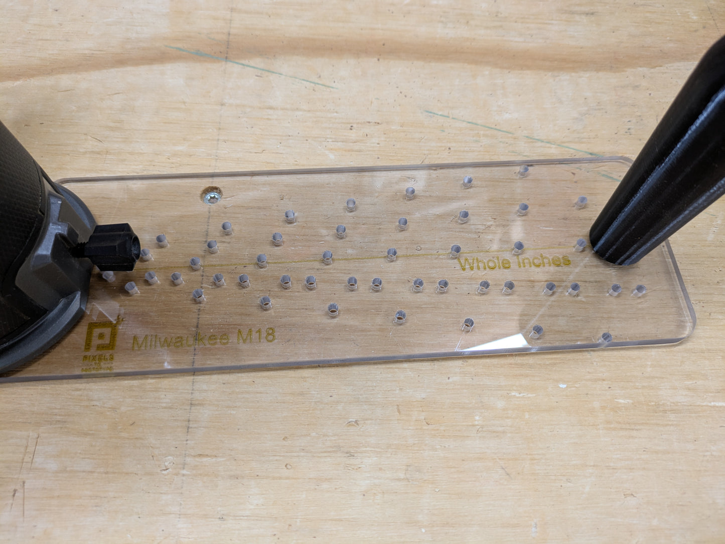 M18 circle jig pivot hole grid detail with whole inch adjustment markings