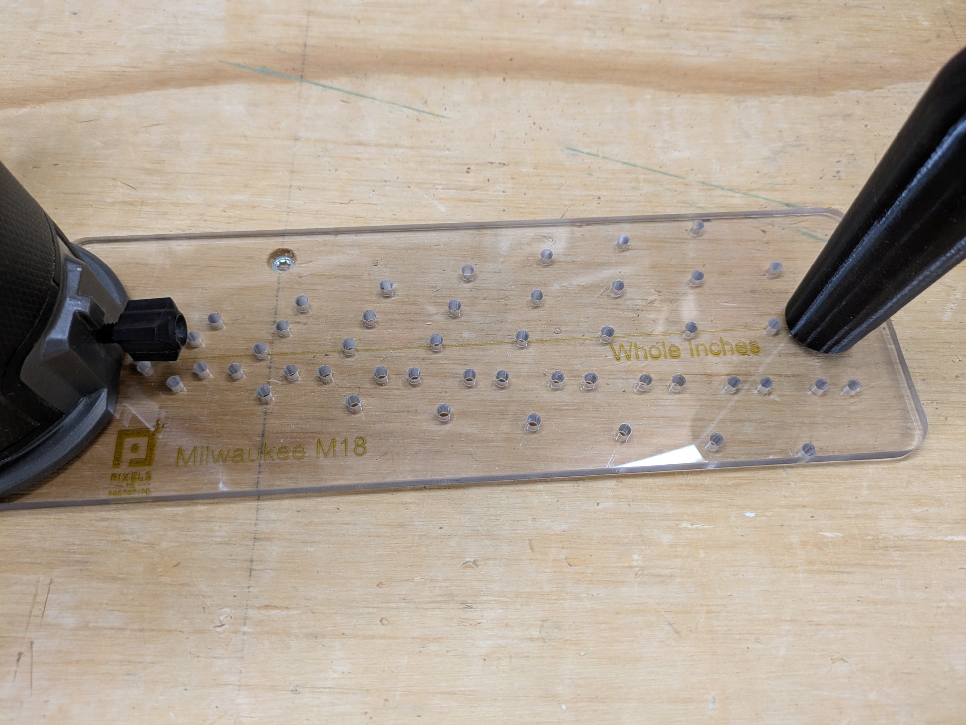 M18 circle jig pivot hole grid detail with whole inch adjustment markings