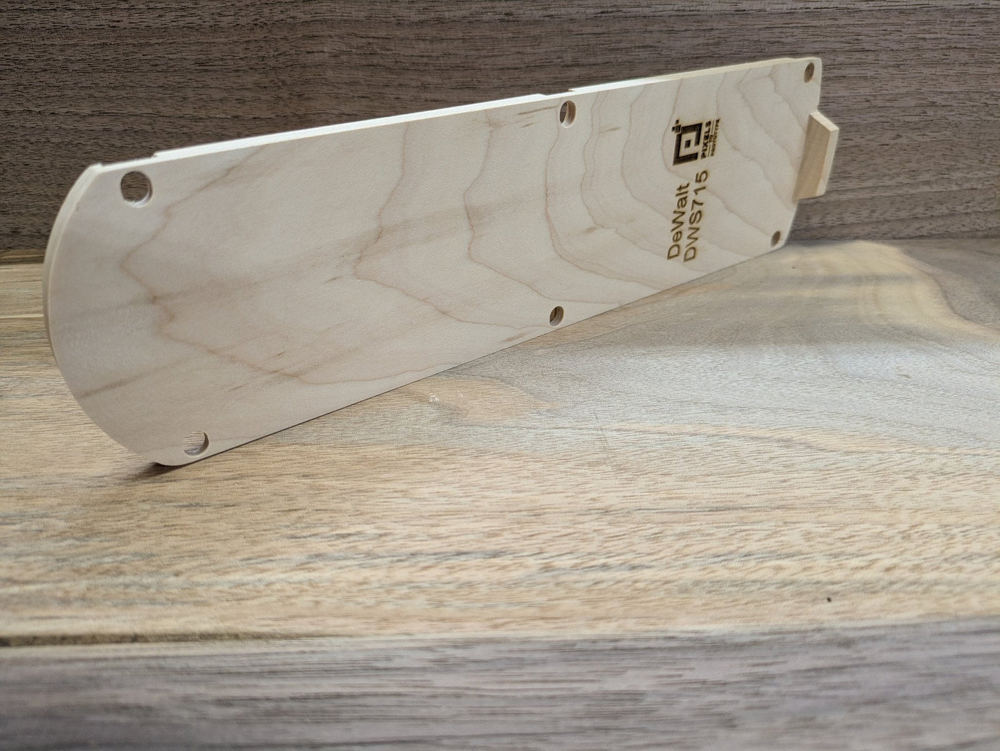Edge profile of the DeWalt DWS715 hardwood zero clearance insert showing thickness and alignment tab