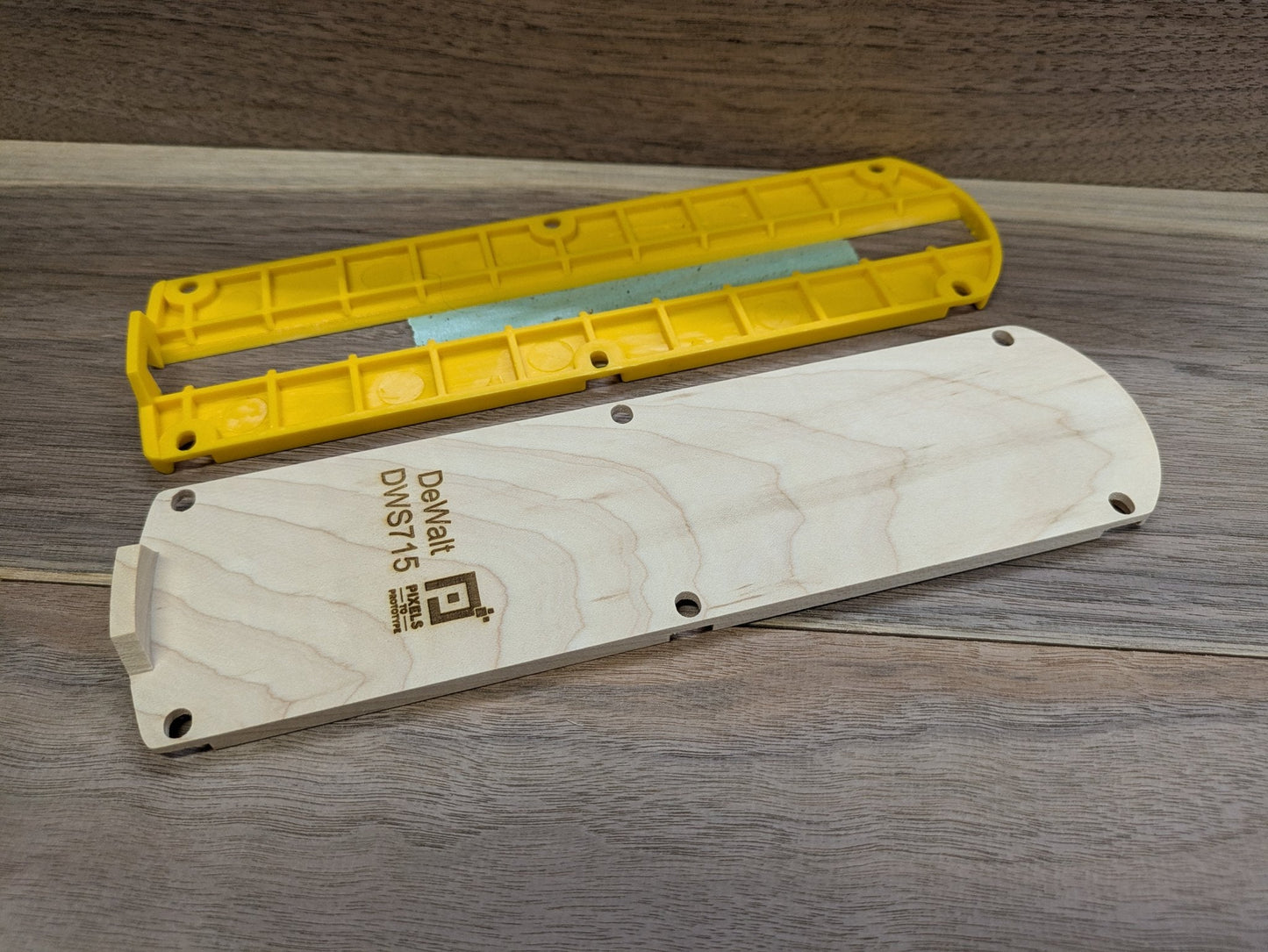 Maple DeWalt DWS715 zero clearance insert next to the yellow factory kerf plate it replaces
