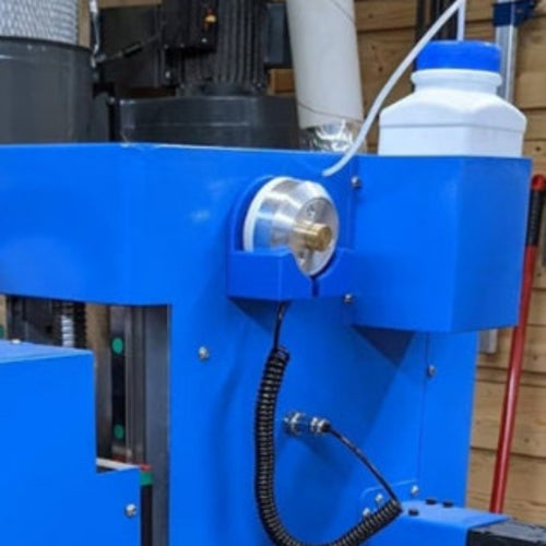 Blue P2P probe mount holding a touch probe on the gantry of a Phantom SCV44 CNC